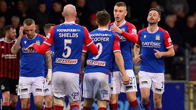 Linfield players celebrate Joel Cooper's first-half goal