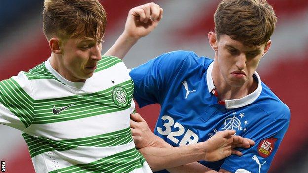Celtic's Luke Donnelly battles with Rangers' Dylan Dykes