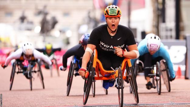 Eden Rainbow-Cooper crosses the line at the 2022 London Marathon