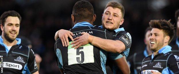 Duncan Weir celebrates the 10th try of the night for Glasgow
