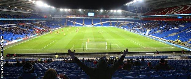 Thousands of Cardiff City fans march against club's blue to red rebrand -  BBC News