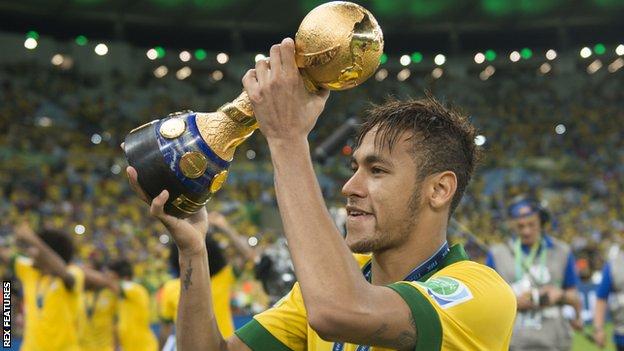 Neymar celebrates with the Confederations Cup trophy