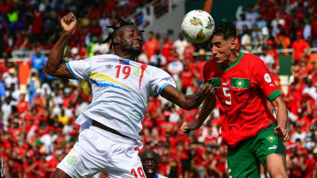 DR Congo's Fiston Mayele and Morocco's Nayef Aguerd battle for a header
