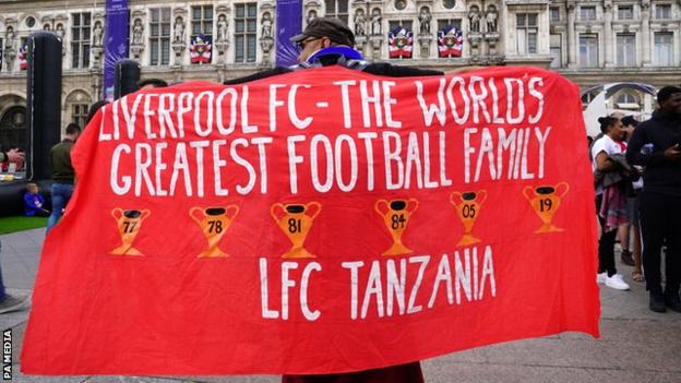 A Liverpool fan shows his support in Paris before the 2022 Champions League final