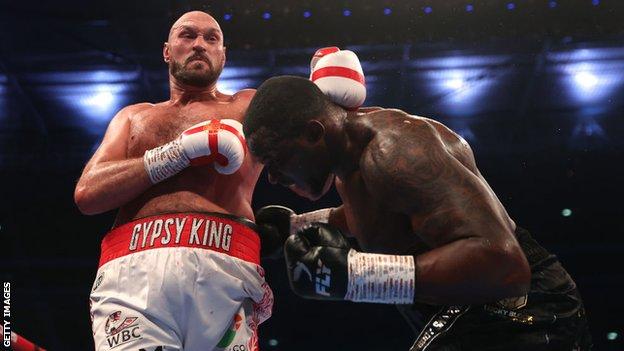 Tyson Fury and Dillian Whyte in action during the WBC World Heavyweight Title Fight between Tyson Fury and Dillian Whyte at Wembley Stadium on April 23, 2022
