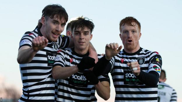 Queen's Park's Jake Davidson, Grant Savory and Simon Murray celebrate a goal against Cove Rangers