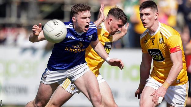 Cavan's Cormac O'Reilly battles with Antrim's Ryan Murray in last year's Ulster quarter-final