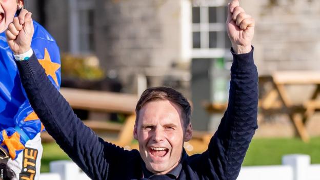 Ronan McNally celebrates a race win in October 2021