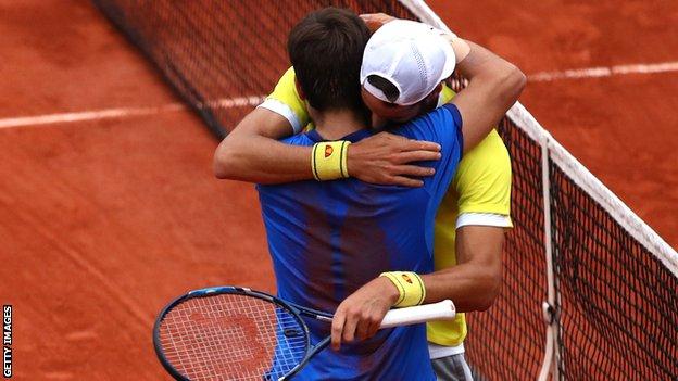 Feliciano Lopez and Marc Lopez embrace