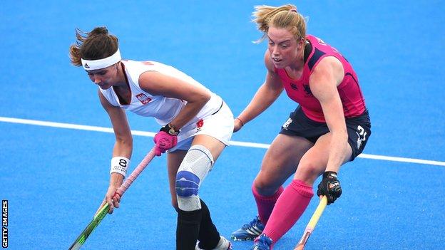 Joanna Wieloch of Poland holds off Alison Howie of Scotland during the EuroHockey Womens Pool C match
