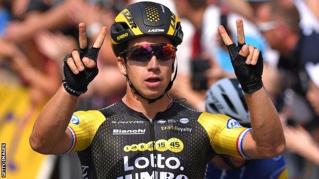 Dylan Groenewegen raises two fingers on each hand to celebrate his second stage win in as many days