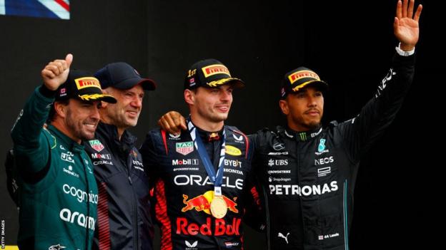 Fernando Alonso, Adrian Newey, Max Verstappen and Lewis Hamilton on the podium after the Canadian Grand Prix