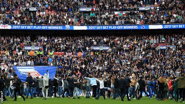 Millwall fans on the pitch at Wembley