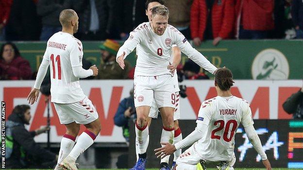 Denmark players celebrate Jorgensen's goal