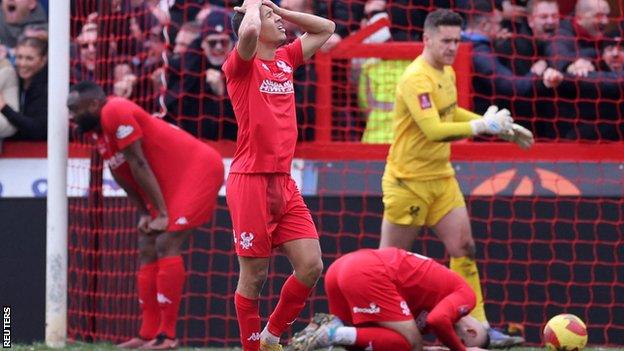 Heartbroken Kidderminster Harriers players