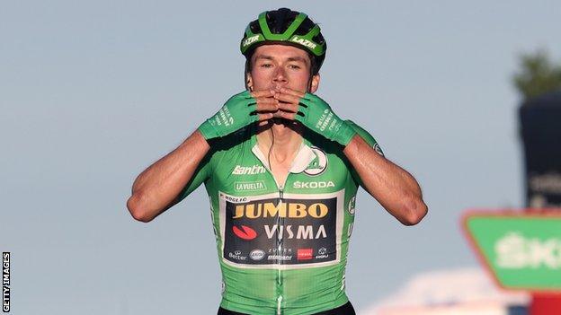 Primoz Roglic celebrates victory on stage eight of the Vuelta a Espana