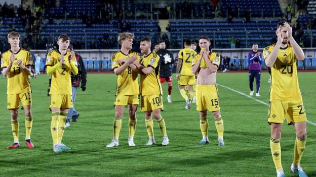 Northern Ireland players applaud their travelling fans after Thursday night's win San Marino