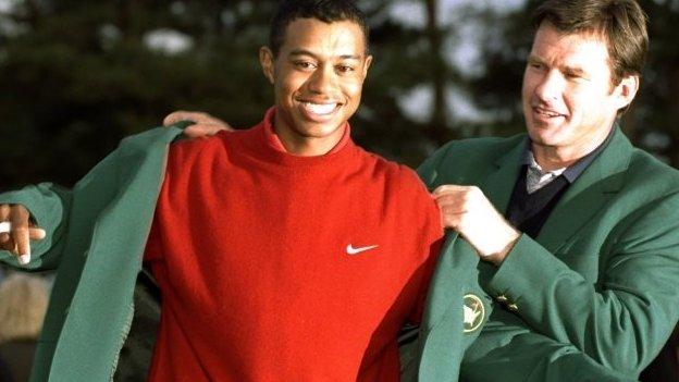 Nick Faldo presenting 1997 Masters champion Tiger Woods with his first Green Jacket