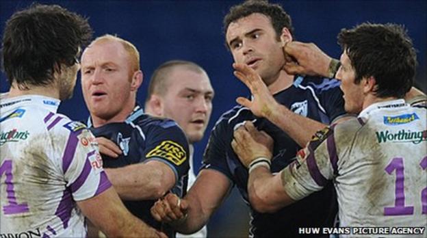 Jamie Roberts, James Hook, Martyn Williams and Mike Phillips tussle in December 2010