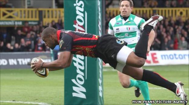 Dragons winger Aled Brew dives over for his first try against Treviso