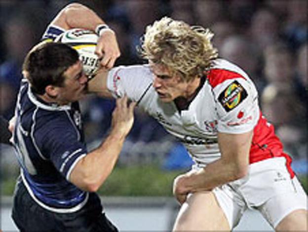 Eoin O'Malley of Leinster is challenged Ulster's Andrew Trimble