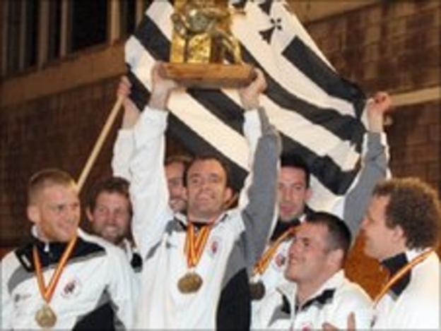 Matthieu le Dour holding the European Trophy aloft