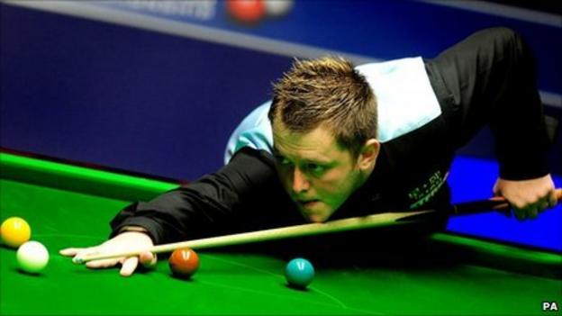 Mark Allen plays a shot during his game against Barry Hawkins at the Crucible