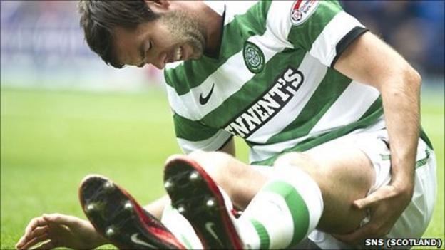Celtic midfielder Joe Ledley nurses his damaged hamstring at Ibrox on Sunday