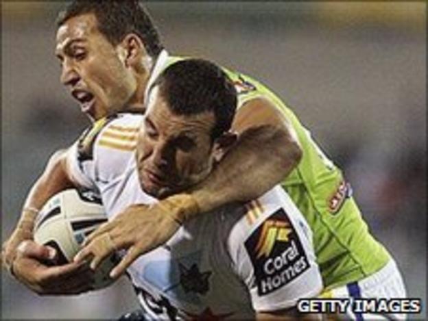 Anthony Laffranchi is tackled while playing for Gold Coast Titans