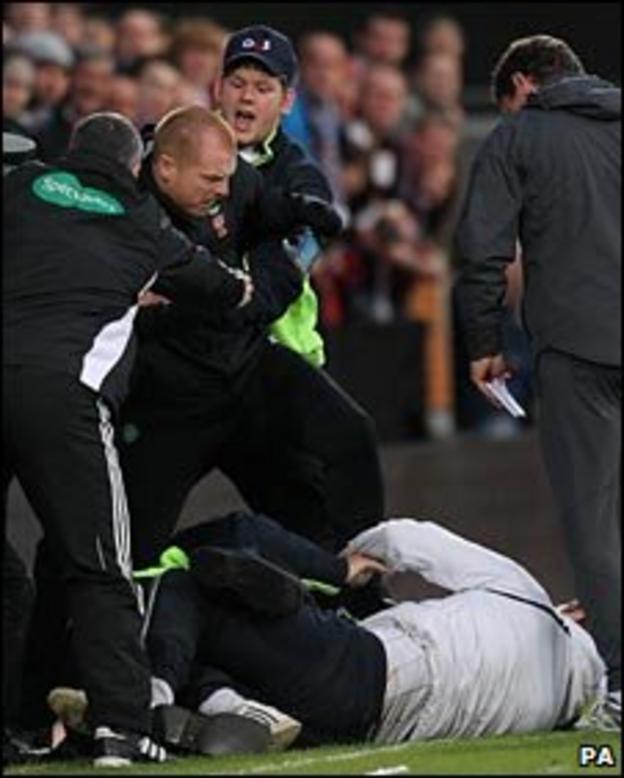 Neil Lennon is confronted by a fan at Tynecastle
