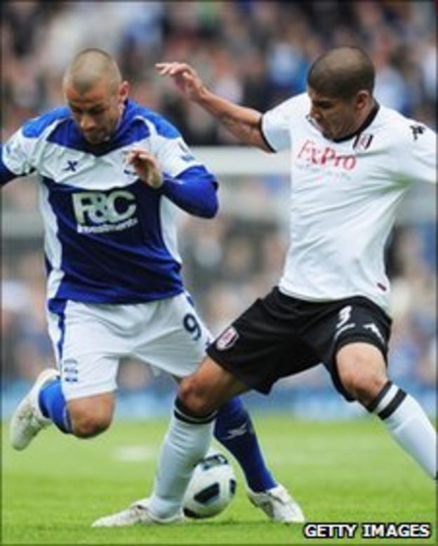 Fulham's Carlos Salcido tackling Birmingham's Kevin Phillips