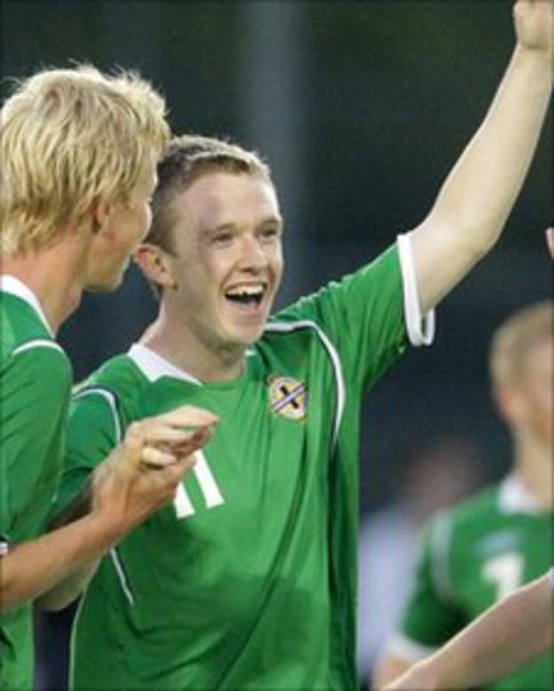 Shane Ferguson celebrates scoring for Northern Ireland in the Milk Cup last year