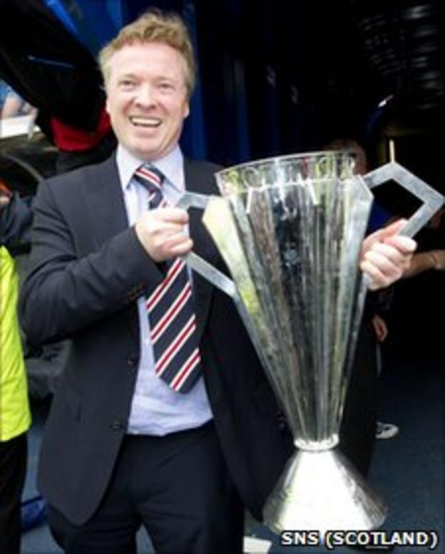 Rangers owner Craig Whyte poses with the SPL trophy
