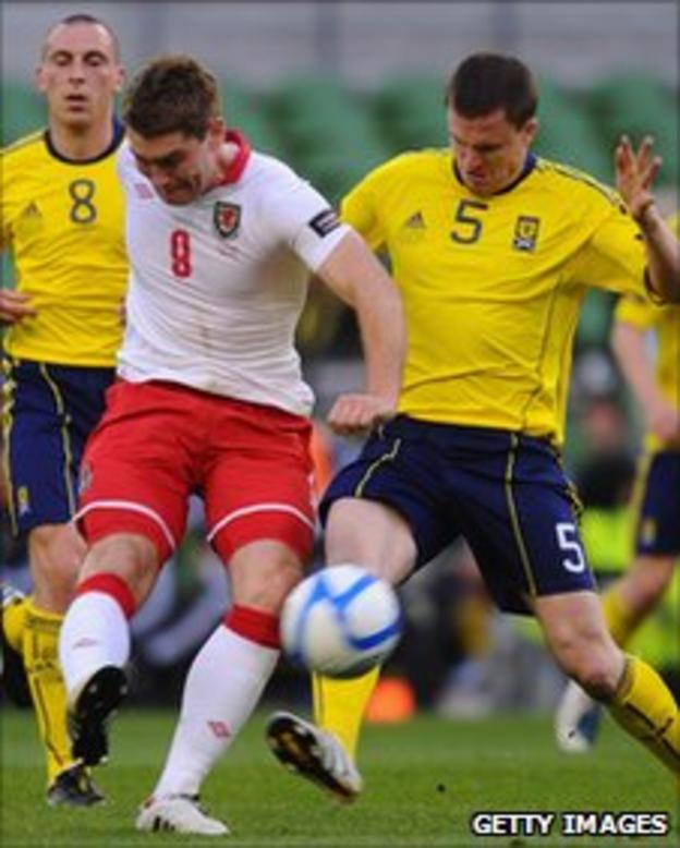 Wales striker Sam Vokes battles with Scotland's Gary Caldwell