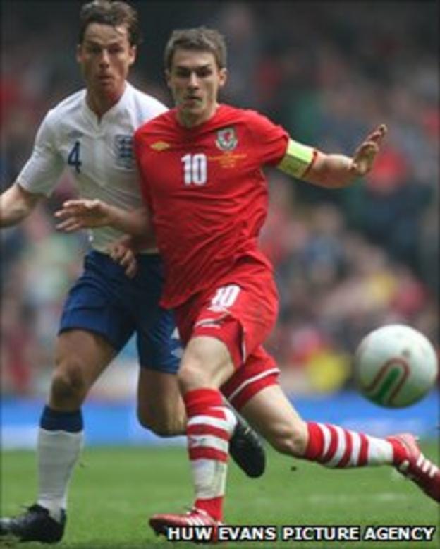 Aaron Ramsey in action against England's Scoptt Parker
