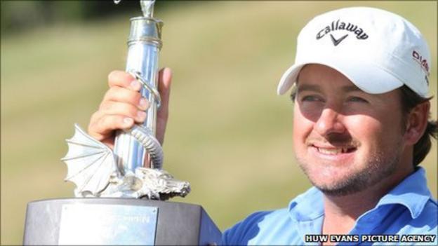 Graeme McDowell lifts the 2010 Wales Open title