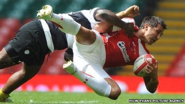 Gavin Henson is tackled by rival Barbarians centre Seru Rabeni on his Wales return