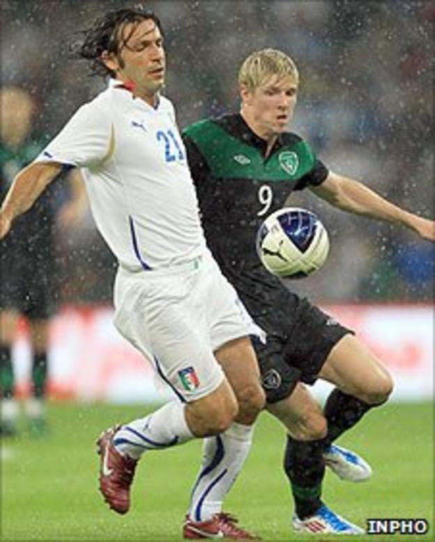 Andrea Pirlo of Italy comes under pressure from the Republic of Ireland's Andy Keogh