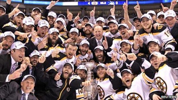The Boston Bruins celebrate in Vancouver