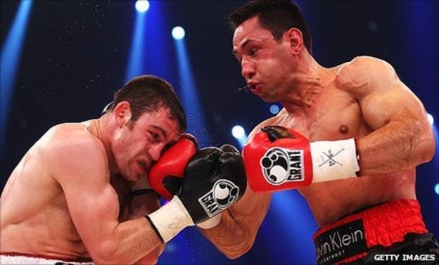 German boxer Felix Sturm (right) hits Matthew Macklin during their bout