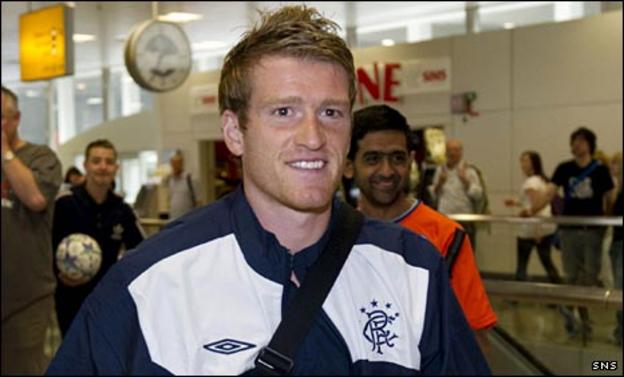 Steven Davis leaves with the Rangers squad