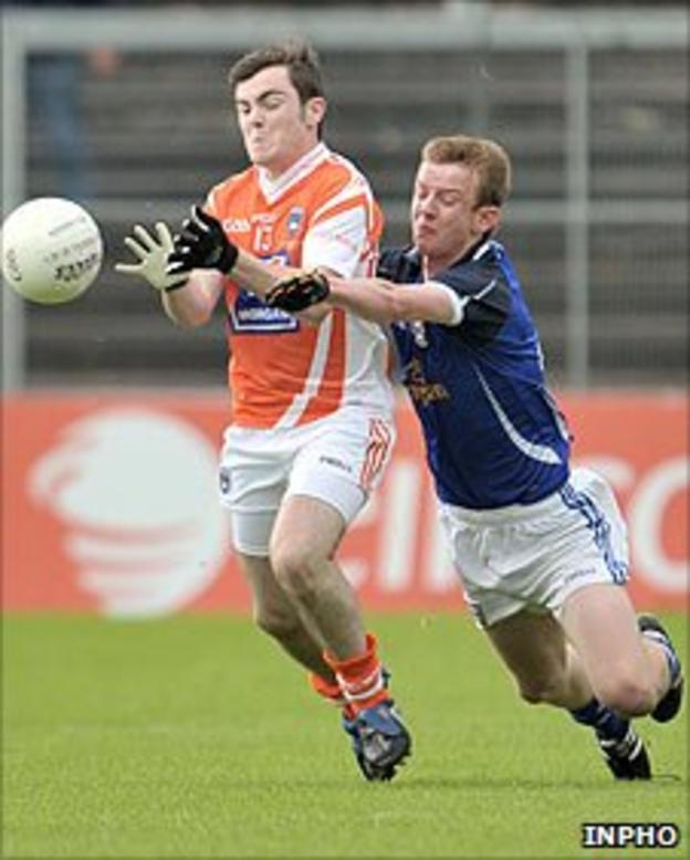 Armagh's Conor McNally competes against Brian Sankey of Cavan