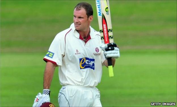 Andrew Strauss raises his bat after reaching his century
