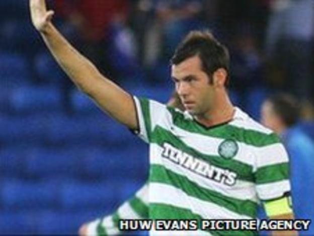 Celtic and Wales midfielder Joe Ledley salutes the Cardiff fans