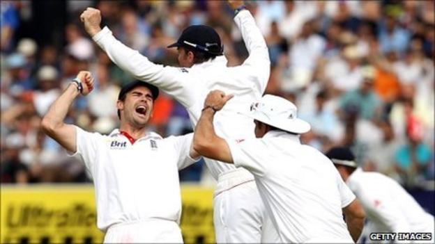 England's players celebrate after taking the final Indian wicket at Lord's