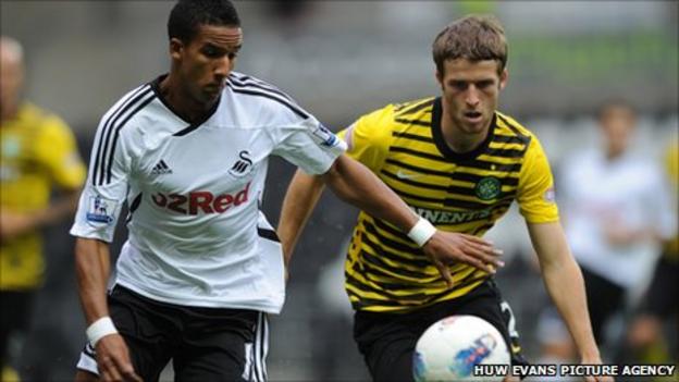 Swansea's Scott Sinclair holds off Celtic defender Adam Matthews