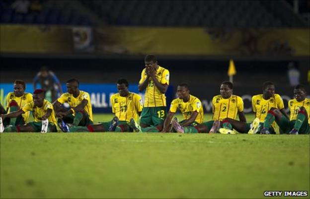 Dejected Cameroon under-20 players after losing a penalty shoot-out