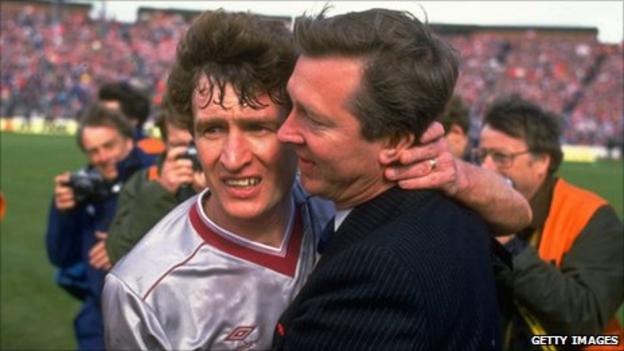 Alex Ferguson (right) Manager of Aberdeen hugs Sandy Jardine (left) of Hearts in commiseration after the Scottish Cup Final match at Hampden Park in Glasgow, Scotland. Aberdeen won the match 3-0.