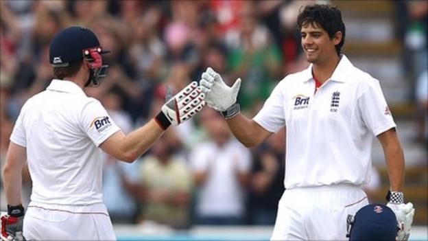 Alastair Cook (right) celebrates his double century with Eoin Morgan