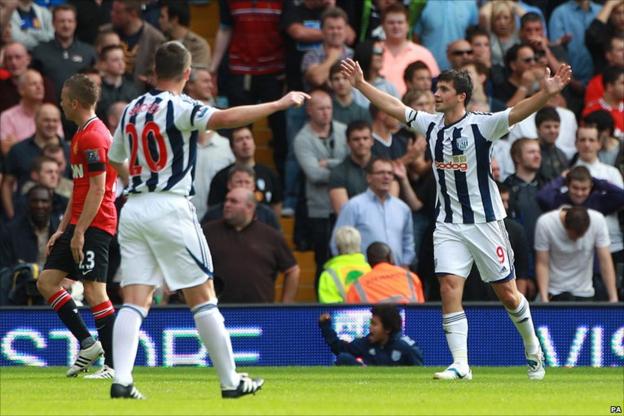 Shane Long (right) scores for West Brom